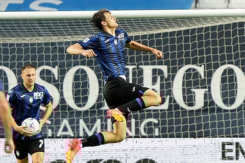 Giorgio Scalvini celebrates after scoring a goal